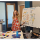 Kara Lehnhardt smiling at the camera while presenting at UMKC