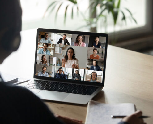 A person in a video meeting discussing a topic
