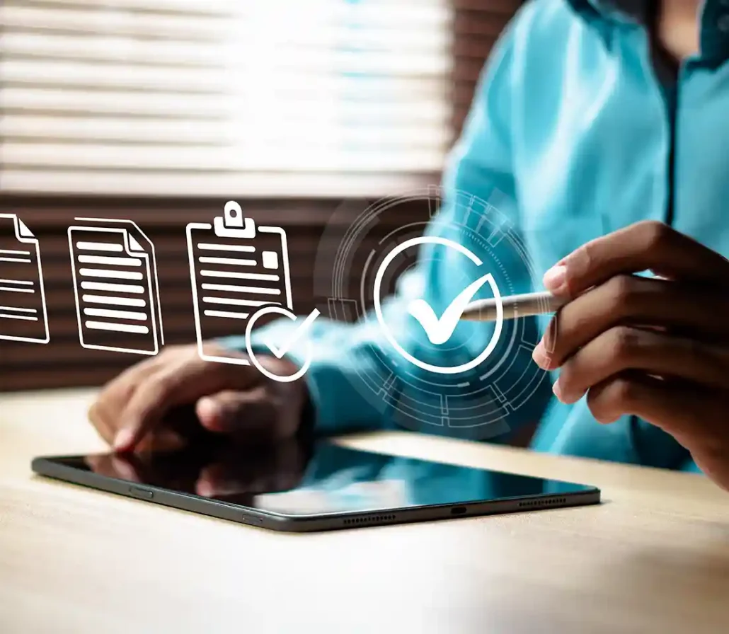 A tablet on a table with a person's hand selecting projected icons.