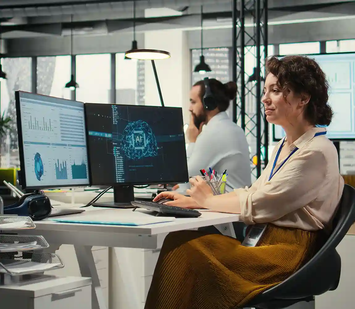 A woman sitting at a desk using AI tools